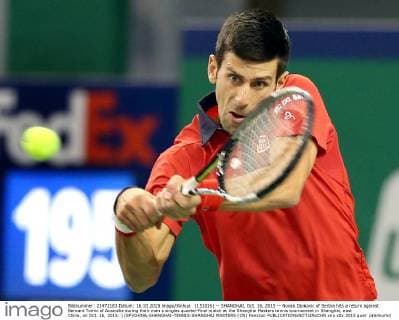 (151016) -- SHANGHAI, Oct. 16, 2015 -- Novak Djokovic of Serbia hits a return against Bernard Tomic of Australia during their men s singles quarter-final match at the Shanghai Masters tennis tournament in Shanghai, east China, on Oct. 16, 2015. ) (SP)CHINA-SHANGHAI-TENNIS-SHANGHAI MASTERS (CN) FanxJun 