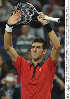 Novak Djokovic of Serbia reacts after defeating Bernard Tomic of Australia in their quarter-final match of the men s singles during the 2015 Shanghai Rolex Masters tennis tournament in Shanghai, China, 16 October 2015. Novak Djokovic of Serbia defeated Bernard Tomic of Australia 2-0 (7-6 6-1) in their quarter-final match of the men s singles during the 2015 Shanghai Rolex Masters tennis tournament in Shanghai, China, 16 October 2015. Novak Djokovic kicks out Bernard Tomic to advance to semi-final at Shanghai Rolex Masters  pbu346293_02