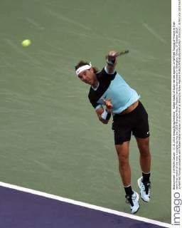 Rafael Nadal of Spain serves against Jo-Wilfried Tsonga of France in their semi-final match of the men s singles during the 2015 Shanghai Rolex Masters tennis tournament in Shanghai, China, 17 October 2015. Jo-Wilfried Tsonga competes with Rafael Nadal of Spain in semi-final at Shanghai Rolex Masters  20151017_31583