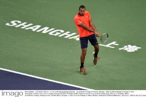 Jo-Wilfried Tsonga of France returns a shot to Rafael Nadal of Spain in their semi-final match of the men s singles during the 2015 Shanghai Rolex Masters tennis tournament in Shanghai, China, 17 October 2015. Jo-Wilfried Tsonga competes with Rafael Nadal of Spain in semi-final at Shanghai Rolex Masters  20151017_08850