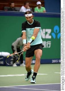 Rafael Nadal of Spain returns a shot to Jo-Wilfried Tsonga of France in their semi-final match of the men s singles during the 2015 Shanghai Rolex Masters tennis tournament in Shanghai, China, 17 October 2015. Jo-Wilfried Tsonga competes with Rafael Nadal of Spain in semi-final at Shanghai Rolex Masters  20151017_31879