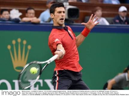 Novak Djokovic of Serbia returns a shot to Jo-Wilfried Tsonga of France in their final match of the men s singles during the 2015 Shanghai Rolex Masters tennis tournament in Shanghai, China, 18 October 2015. Novak Djokovic of Serbia defeated Jo-Wilfried Tsonga of France 2-0 (6-2 6-4) in their final match of the men s singles during the 2015 Shanghai Rolex Masters tennis tournament in Shanghai, China, 18 October 2015. Djokovic defeats Jo-Wilfried Tsonga to win Shanghai Masters final  pbu347022_10
