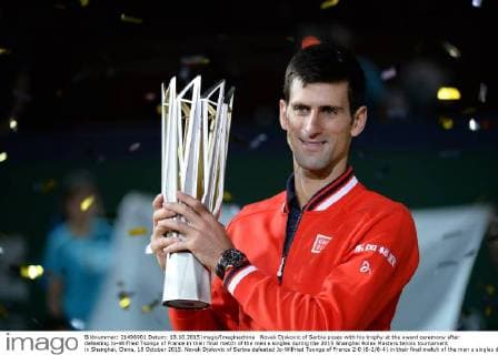 Novak Djokovic of Serbia poses with his trophy at the award ceremony after defeating Jo-Wilfried Tsonga of France in their final match of the men s singles during the 2015 Shanghai Rolex Masters tennis tournament in Shanghai, China, 18 October 2015. Novak Djokovic of Serbia defeated Jo-Wilfried Tsonga of France 2-0 (6-2 6-4) in their final match of the men s singles during the 2015 Shanghai Rolex Masters tennis tournament in Shanghai, China, 18 October 2015. Djokovic defeats Jo-Wilfried Tsonga to win Shanghai Masters final  20151018_65917