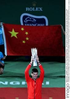 Novak Djokovic of Serbia holds up his trophy at the award ceremony after defeating Jo-Wilfried Tsonga of France in their final match of the men s singles during the 2015 Shanghai Rolex Masters tennis tournament in Shanghai, China, 18 October 2015. Novak Djokovic of Serbia defeated Jo-Wilfried Tsonga of France 2-0 (6-2 6-4) in their final match of the men s singles during the 2015 Shanghai Rolex Masters tennis tournament in Shanghai, China, 18 October 2015. Djokovic defeats Jo-Wilfried Tsonga to win Shanghai Masters final  pbu347071_02