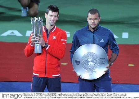 Novak Djokovic of Serbia, left, and Jo-Wilfried Tsonga of France pose with their trophies at the award ceremony after their final match of the men s singles during the 2015 Shanghai Rolex Masters tennis tournament in Shanghai, China, 18 October 2015. Novak Djokovic of Serbia defeated Jo-Wilfried Tsonga of France 2-0 (6-2 6-4) in their final match of the men s singles during the 2015 Shanghai Rolex Masters tennis tournament in Shanghai, China, 18 October 2015. Djokovic defeats Jo-Wilfried Tsonga to win Shanghai Masters final  pbu347071_03