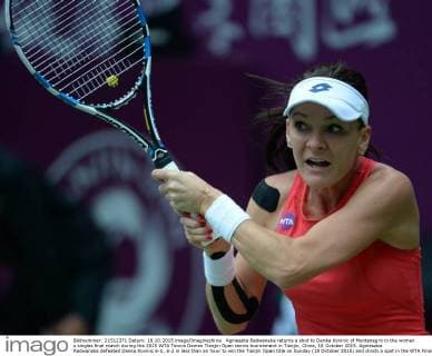 Agnieszka Radwanska returns a shot to Danka Kovinic of Montenegro in the women s singles final match during the 2015 WTA Tennis Damen Tianjin Open tennis tournament in Tianjin, China, 18 October 2015. Agnieszka Radwanska defeated Danka Kovinic 6-1, 6-2 in less than an hour to win the Tianjin Open title on Sunday (18 October 2015) and clinch a spot in the WTA Finals in Singapore. The second-seeded Radwanska broke Kovinic five times and saved all five break points she faced. The Polish player didn t lose a set in five matches this week to win her 16th career WTA Tour title. Radwanska became the fifth player to qualify for the year-end championships, joining Maria Sharapova, Simona Halep, Petra Kvitova and Garbine Muguruza in the field. Top-ranked Serena Williams is skipping the tournament to rest and recover from injuries. Radwanska has qualified for the WTA Finals for the fifth consecutive year. Radwanska wins Tianjin Open to qualify for WTA Finals  20151018_35203
