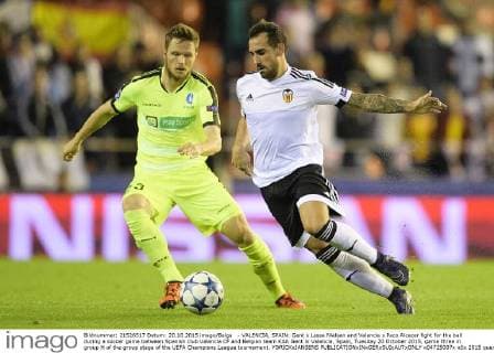 - VALENCIA, SPAIN: Gent s Lasse Nielsen and Valencia s Paco Alcacer fight for the ball during a soccer game between Spanish club Valencia CF and Belgian team KAA Gent in Valencia, Spain, Tuesday 20 October 2015, game three in group H of the group stage of the UEFA Champions League tournament. YORICKxJANSENS  x04725007x