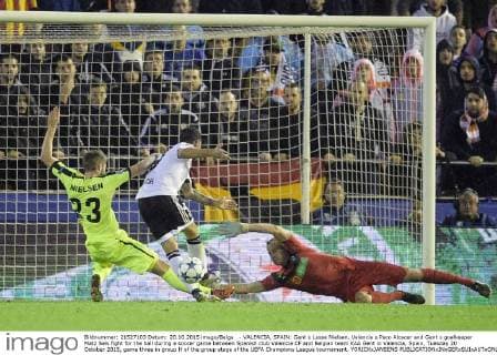 - VALENCIA, SPAIN: Gent s Lasse Nielsen, Valencia s Paco Alcacer and Gent s goalkeeper Matz Sels fight for the ball during a soccer game between Spanish club Valencia CF and Belgian team KAA Gent in Valencia, Spain, Tuesday 20 October 2015, game three in group H of the group stage of the UEFA Champions League tournament. YORICKxJANSENS  x04725033x