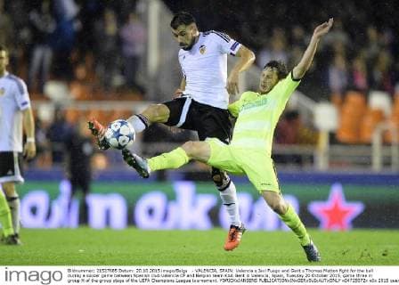 - VALENCIA, SPAIN: Valencia s Javi Fuego and Gent s Thomas Matton fight for the ball during a soccer game between Spanish club Valencia CF and Belgian team KAA Gent in Valencia, Spain, Tuesday 20 October 2015, game three in group H of the group stage of the UEFA Champions League tournament. YORICKxJANSENS  x04725072x