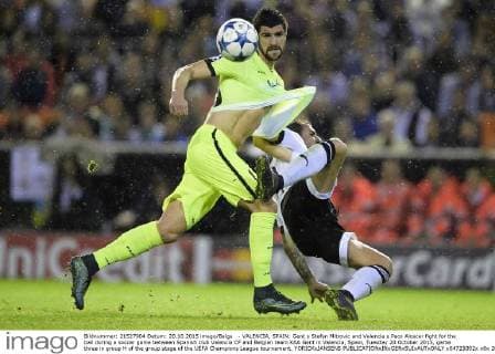 - VALENCIA, SPAIN: Gent s Stefan Mitrovic and Valencia s Paco Alcacer fight for the ball during a soccer game between Spanish club Valencia CF and Belgian team KAA Gent in Valencia, Spain, Tuesday 20 October 2015, game three in group H of the group stage of the UEFA Champions League tournament. YORICKxJANSENS  x04725092x