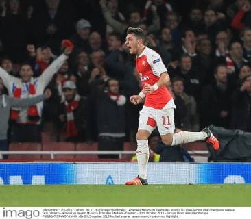 Arsenal s Mesut Ozil celebrates scoring his sides second goal Champions League Group Match - Arsenal vs Bayern Munich - Emirates Stadium - England - 20th October 2015 - Picture David Klein Sportimage EDITORIAL USE ONLY. No use with unauthorised audio, video, data, fixture lists, club league logos or live services. Online in-match use limited to 120 images, no video emulation. No use in betting, games or single club league player publications.