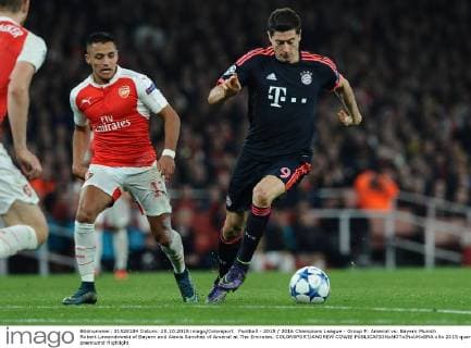 Football - 2015 2016 Champions League - Group F: Arsenal vs. Bayern Munich Robert Lewandowski of Bayern and Alexis Sanchez of Arsenal at The Emirates. COLORSPORT ANDREW COWIE 