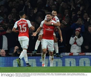 Football - 2015 2016 Champions League - Group F: Arsenal vs. Bayern Munich Oliveir Giroud of Arsenal celebrates his goal with Alexis Sanchez at The Emirates. COLORSPORT ANDREW COWIE 