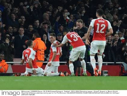 Football - 2015 2016 Champions League - Group F: Arsenal vs. Bayern Munich Mesut Ozil of Arsenal celebrates scoring goal no 2 at The Emirates. COLORSPORT ANDREW COWIE 