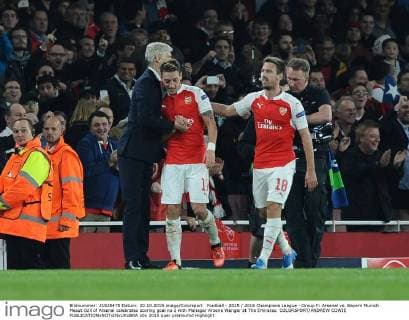 Football - 2015 2016 Champions League - Group F: Arsenal vs. Bayern Munich Mesut Ozil of Arsenal celebrates scoring goal no 2 with Manager Arsene Wenger at The Emirates. COLORSPORT ANDREW COWIE 