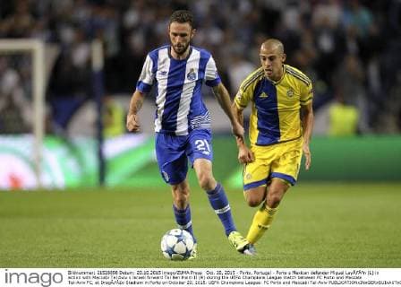 Oct. 20, 2015 - Porto, Portugal - Porto s Mexican defender Miguel LayÃƒÂºn (L) in action with Maccabi Tel Aviv s Israeli forward Tal Ben Haim II (R) during the UEFA Champions League match between FC Porto and Maccabi Tel-Aviv FC, at DragÃƒÂ£o Stadium in Porto on October 20, 2015. UEFA Champions League: FC Porto and Maccabi Tel-Aviv  - ZUMAn230
