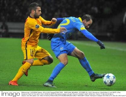 BARYSAW, BELARUS. OCTOBER 20, 2015. Barcelona s Jordi Alba (L) and BATE s Ihar Stasevich fight for the ball in their 2015 16 UEFA Champions League Group E Round 3 football match at Borisov Arena. FC Barcelona Barca (Spain) won the game 2:0. Viktor Drachev TASS  TS010384