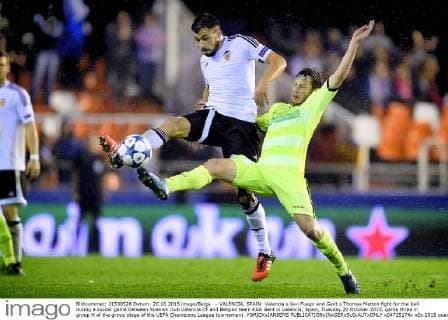 - VALENCIA, SPAIN: Valencia s Javi Fuego and Gent s Thomas Matton fight for the ball during a soccer game between Spanish club Valencia CF and Belgian team KAA Gent in Valencia, Spain, Tuesday 20 October 2015, game three in group H of the group stage of the UEFA Champions League tournament. YORICKxJANSENS  x04725174x