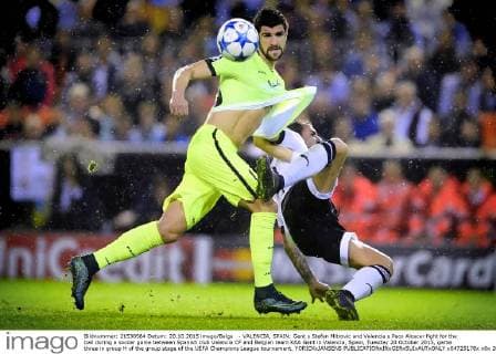 - VALENCIA, SPAIN: Gent s Stefan Mitrovic and Valencia s Paco Alcacer fight for the ball during a soccer game between Spanish club Valencia CF and Belgian team KAA Gent in Valencia, Spain, Tuesday 20 October 2015, game three in group H of the group stage of the UEFA Champions League tournament. YORICKxJANSENS  x04725178x