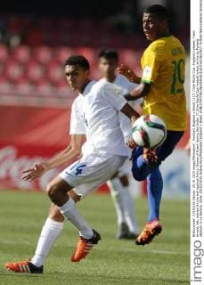 Football, England v Brasil. U 17, Chile World Cup. England s player, Trent Arnold, left, battles for the ball against Arthur Gomes of Brazil during the Under 17 Chile World Cup football match at the La Portada stadium in La Serena, Chile. 20 10 2015 Andres Pina Photosport England v Brasil. 