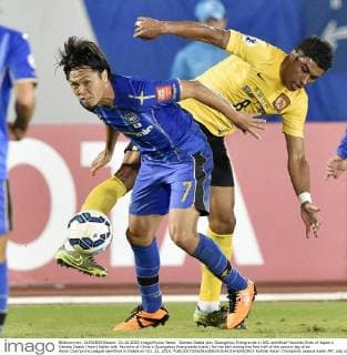 Gamba Osaka play Guangzhou Evergrande in ACL semifinal Yasuhito Endo of Japan s Gamba Osaka (front) fights with Paulinho of China s Guangzhou Evergrande (back) for the ball during the first half of the second leg of an Asian Champions League semifinal in Osaka on Oct. 21, 2015. 