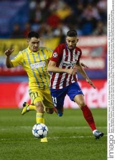 FuÃŸball, Champions League, Atletico Madrid - FK Astana 21.10.2015. Madrid, Spain. Serikzhan Muzhikov (11) Astana Amunt Yannick Carrasco (21) Atletico de Madrid during the soccer match UCL Champions League between Atletico de Madrid versus Astana Amunt at the Vicente Calderon stadium in Madrid xEnriquexdexlaxFuentex  ActionPlus11674172