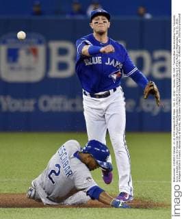 Oct. 21, 2015 - Toronto, ON, CAN - Toronto Blue Jays shortstop Troy Tulowitzki turns a double play over the Kansas City Royals Alcides Escobar in the fourth inning during Game 5 of the ALCS on Wednesday, Oct. 21, 2015, at Rogers Centre in Toronto. Kansas City at Toronto, ALCS Game 5 - ZUMAm67_