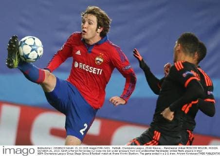 FuÃŸball, Champions League, ZSKA Moskau - Manchester United MOSCOW REGION, RUSSIA. OCTOBER 21, 2015. CSKA s Marion Fernandes (L) kicks the ball under pressure from and unidentified Manchester United ManU players in their UEFA Champions League Group Stage Group B football match at Arena Khimki Stadium. The game ended in a 1-1 draw. Artyom Korotayev TASS  TS010529
