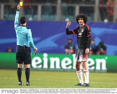 FuÃŸball, Champions League, ZSKA Moskau - Manchester United MOSCOW REGION, RUSSIA. OCTOBER 21, 2015. Manchester United ManU s Marouane Fellaini (R) receives a yellow card in their UEFA Champions League Group Stage Group B football match against CSKA Moscow at Arena Khimki Stadium. The game ended in a 1-1 draw. Artyom Korotayev TASS  TS01054D