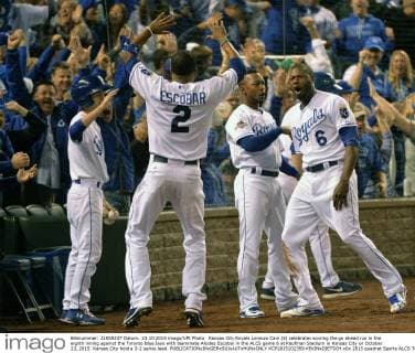 Kansas City Royals Lorenzo Cain (6) celebrates scoring the go ahead run in the eighth inning against the Toronto Blue Jays with teammate Alcides Escobar in the ALCS game 6 at Kaufman Stadium in Kansas City on October 23, 2015. Kansas City hold a 3-2 series lead.  KCP2015102359 KEVINxDIETSCH