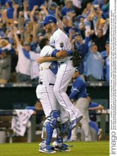 Kansas City Royals pitcher Wade Davis (R) leaps into the arms of catcher Salvador Perez after winning the ALCS game 6 at Kaufman Stadium in Kansas City on October 23, 2015. Kansas City beats Toronto 4-3 to win the 2015 ALCS.  KCP2015102367 KEVINxDIETSCH