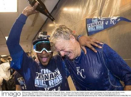 Kansas City Royals Alcides Escobar pours champaign on first base coach Rusty Kuntz as they celebrate in the clubhouse after the Royals won the American Leave Championship Series after defeating the Toronto Blue Jays 4-3 in game 6 at Kaufman Stadium in Kansas City on October 23, 2015. Hosmer drove home the game winning run.  KCP20151024806 KEVINxDIETSCH