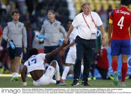 U 17, Chile World Cup. England s manager, Neil Dewsnip, right, comforts Kazaiah Sterling after be elimiated of the Under 17 Chile World Cup after the football match against Korea Republic at the Federico Sanchez Rumoroso stadium in Coquimbo, Chile. 23 10 2015 AndresPina Photosport . 