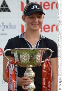GURGAON, INDIA - OCTOBER 25: Golfer Emily Kristine Pedersen with the trophy after winning the championship during the 9th Edition of Hero Womens Indian Open Golf Championship at the DLF Golf & Country Club, on October 25, 2015 in Gurgaon, India. Denmark s Emily Kristine Pedersen won the title following a 73 in the $400,000 Hero Womens Indian Open. (Photo by Parveen Kumar Hindustan Times ) 9th Edition Of Hero Womens Indian Open Golf Championship