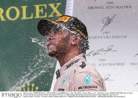 Oct. 25, 2015 - Austin, Texas, U.S - Mercedes driver LEWIS HAMILTON (44) of Great Britain stands on the podium after winning the Formula 1 United States Grand Prix race at the Circuit of the Americas race track in Austin,Texas. F1 2015 - Formula 1 United States Grand Prix. - ZUMAw300