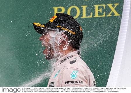 Oct. 25, 2015 - Austin, Texas, U.S - Mercedes driver LEWIS HAMILTON (44) of Great Britain stands on the podium after winning the Formula 1 United States Grand Prix race at the Circuit of the Americas race track in Austin,Texas. F1 2015 - Formula 1 United States Grand Prix. - ZUMAw300