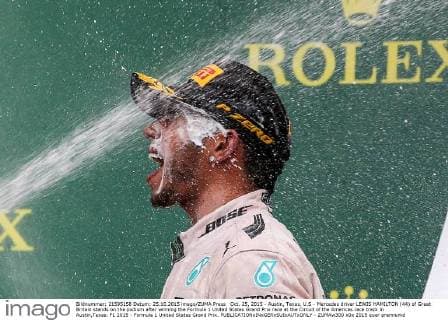 Oct. 25, 2015 - Austin, Texas, U.S - Mercedes driver LEWIS HAMILTON (44) of Great Britain stands on the podium after winning the Formula 1 United States Grand Prix race at the Circuit of the Americas race track in Austin,Texas. F1 2015 - Formula 1 United States Grand Prix. - ZUMAw300