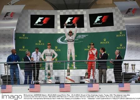 25.10.2015. Circuit of the Americas, Austin, Texas, USA. The delayed race after qualifying was held early Sunday. Mercedes AMG Petronas F1 driver -Lewis Hamilton celebrates on the podium as he wins at Austin and the world driver championship followed by team mate Nico Rosberg and Scuderia Ferrari - Sebastian Vettel xLeannexBoonx  ActionPlus11675937