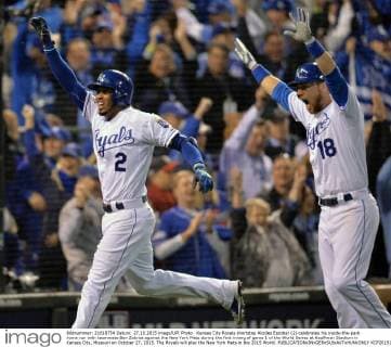 Kansas City Royals shortstop Alcides Escobar (2) celebrates his inside-the-park home run with teammate Ben Zobrist against the New York Mets during the first inning of game 1 of the World Series at Kauffman Stadium in Kansas City, Missouri on October 27, 2015. The Royals will play the New York Mets in the 2015 World.  KCP2015102703 KEVINxDIETSCH