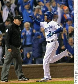 Kansas City Royals shortstop Alcides Escobar (R) crosses home plate with home plate umpire Bill Welke watching after a lead off inside-the-park home run during the first inning against the New York Mets in game 1 of the World Series at Kauffman Stadium in Kansas City, Missouri on October 27, 2015. The Royals will play the New York Mets in the 2015 World.  KCP2015102705 KEVINxDIETSCH