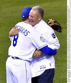 Oct. 27, 2015 - Kansas City, MO, USA - Kansas City Royals third baseman Mike Moustakas (8) hugs Royals legend George Brett after Brett threw out the ceremonial first pitch before Game 1 of the World Series against the New York Mets on Tuesday, Oct. 27, 2015, at Kauffman Stadium in Kansas City, Mo. World Series, NY Mets at Kansas City, Game 1 - ZUMAm67_