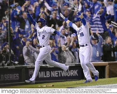 Oct. 27, 2015 - Kansas City, MO, USA - The Kansas City Royals Alcides Escobar (2) celebrates with teammate Ben Zobrist (18) after hitting an inside-the-park home run in the first inning against the New York Mets in Game 1 of the World Series on Tuesday, Oct. 27, 2015, at Kauffman Stadium in Kansas City, Mo. World Series, NY Mets at Kansas City, Game 1 - ZUMAm67_