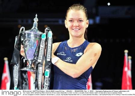 (151101) -- SINGAPORE, Nov. 1, 2015 -- Agnieszka Radwanska of Poland celebrates with her trophy after defeating Petra Kvitova of the Czech Republic in their women s singles finals tennis match of the WTA Tennis Damen Finals at the Singapore Indoor Stadium November 1, 2015. Agnieszka Radwanska won 2-1 and claimed the title.) (SP)SINGAPORE-WTA-FINALS ThenxChihxWey 