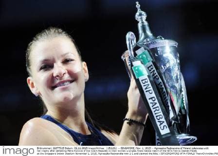 (151101) -- SINGAPORE, Nov. 1, 2015 -- Agnieszka Radwanska of Poland celebrates with her trophy after defeating Petra Kvitova of the Czech Republic in their women s singles finals tennis match of the WTA Tennis Damen Finals at the Singapore Indoor Stadium November 1, 2015. Agnieszka Radwanska won 2-1 and claimed the title.) (SP)SINGAPORE-WTA-FINALS ThenxChihxWey 