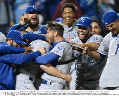 Members of the Kansas City Royals swarm closer Wade Davis as they celebrate winning the World Series, defeating the New York Mets 7-2 in game 5 at Citi Field in New York City on November 1, 2015. The Royals won the series 4 games to 1.  NYP20151101856 PATxBENIC