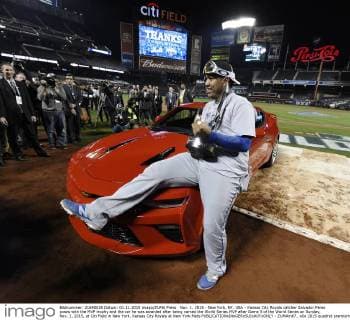 Nov. 1, 2015 - New York, NY, USA - Kansas City Royals catcher Salvador Perez poses with the MVP trophy and the car he was awarded after being named the World Series MVP after Game 5 of the World Series on Sunday, Nov. 1, 2015, at Citi Field in New York. Kansas City Royals at New York Mets - ZUMAm67_