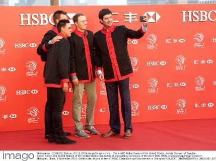 (From left) Rickie Fowler of the United States, Henrik Stenson of Sweden, Jordan Spieth and Bubba Watson of the United States take selfies at the opening ceremony of the 2015 WGC HSBC Champions golf tournament in Shanghai, China, 3 November 2015. Golfers beat drums to tee off HSBC Champions golf tournament in Shanghai  20151103_82711