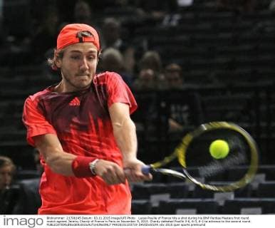 Lucas Pouille of France hits a shot during his BNP Paribas Masters first round match against Jeremy Chardy of France in Paris on November 3, 2015. Chardy defeated Pouille 3-6, 6-3, 6-2 to advance to the second round.  PAR20151103719 DAVIDxSILPA
