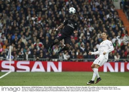 Real Madrid s Cristiano Ronaldo (R) and Paris Saint-Germain s Serge Aurier during Champions League soccer match between Real Madrid and Paris Saint Germain at Santiago Bernabeu stadium in Madrid, Spain. November 03, 2015.  (20151103073)
