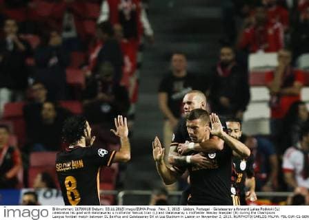 Nov. 3, 2015 - Lisbon, Portugal - Galatasaray s forward Lukas Podolski (L) celebrates his goal with Galatasaray s midfielder Selcuk Inan (L) and Galatasaray s midfielder Wesley Sneijder (B) during the Champions League football match between SL Benfica and Galatasaray SK at Luz Stadium in Lisbon on November 3, 2015. NURPHOTO CARLOS PALMA. FBL-EUR-C1-BENFICA-GALATASARAY  - ZUMAn230